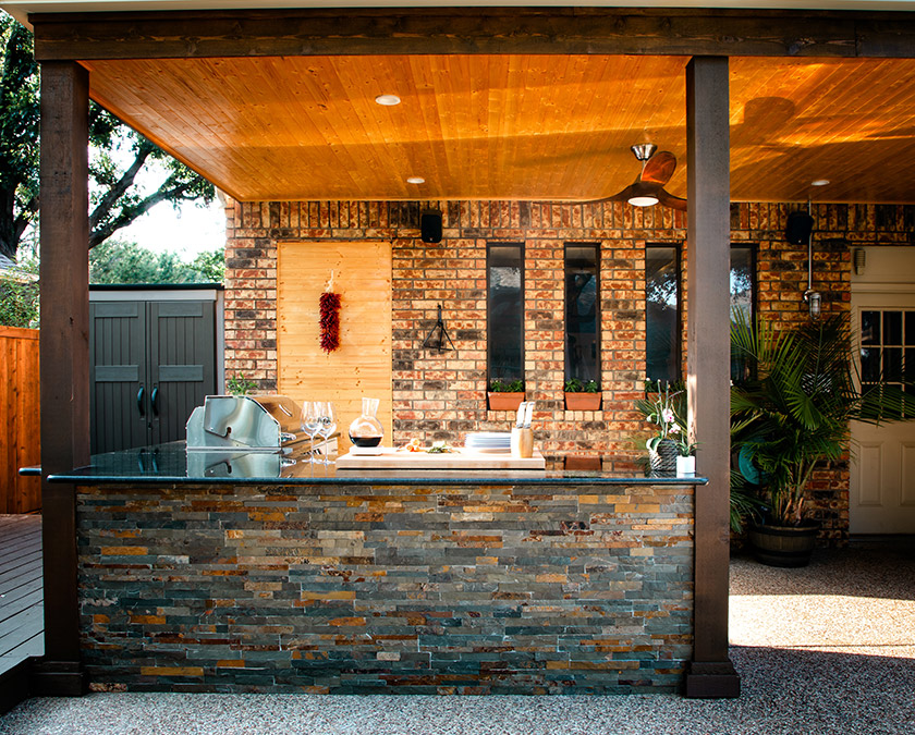 Multicolored stone covered outdoor kitchen