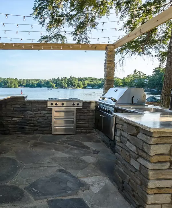 Blue Bell stone outdoor kitchen with beautiful cooking grill and barbecue